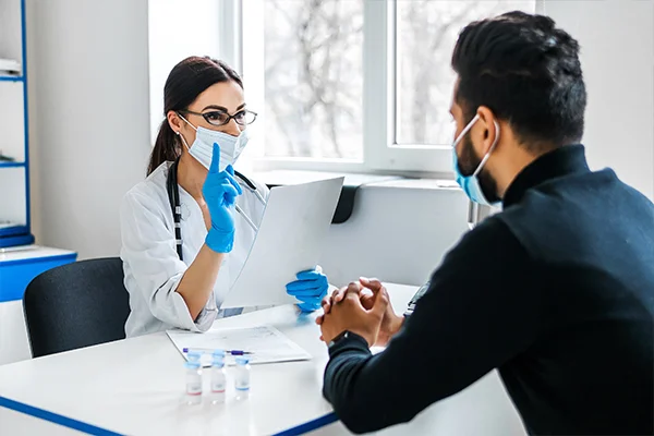 A person consulting with a healthcare professional