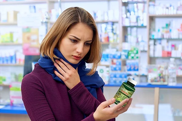 A person reading product label of garcinia cambogia tea