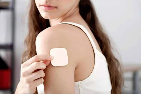 An illustrative image found within the 'What to Avoid When Taking Glutathione' post by PatchMD - Vitamin Patches and Supplements, depicting a person applying a glutathione patch for supplementation.