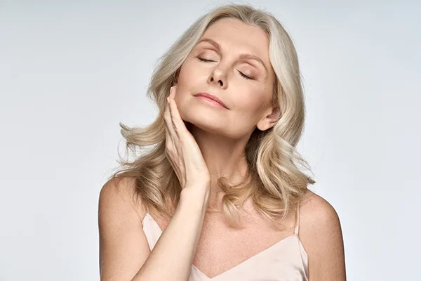 Image featured in the 'What Are the Signs of Coming to the End of Menopause?' post for PatchMD - Vitamin Patches and Supplements, depicting a woman in her late 40s or early 50s engaging in preventative measures to reduce the risk of developing osteoporosis and cardiovascular disease.