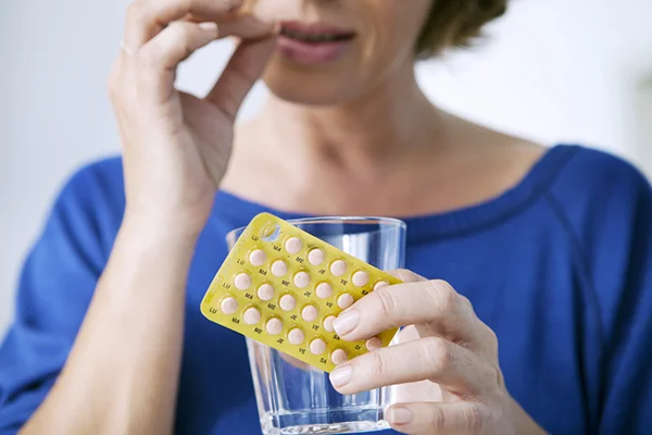 Visual element for the 'Conquer Menopause Belly: Strategies for Losing Weight and Slimming Your Mid-Section' post by PatchMD - Vitamin Patches and Supplements. The image depicts a woman undergoing hormone therapy as part of an approach to reduce 'menopause belly,' aligning with the topic discussed in the article.