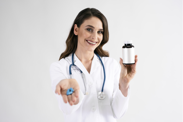 A person holding a bottle of magnesium supplements