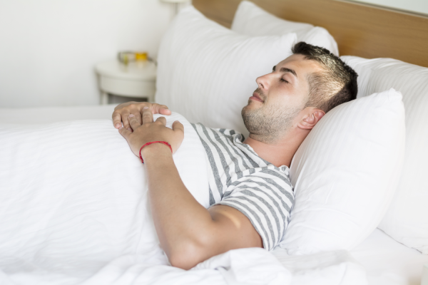 A person using a magnesium patch to improve sleep quality