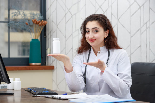 A person holding a bottle of magnesium supplement