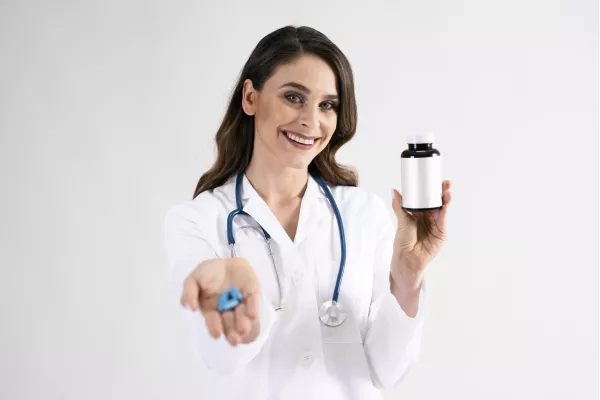 A person holding a bottle of magnesium supplements