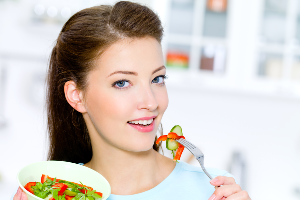 A person holding a plate with magnesium-rich foods